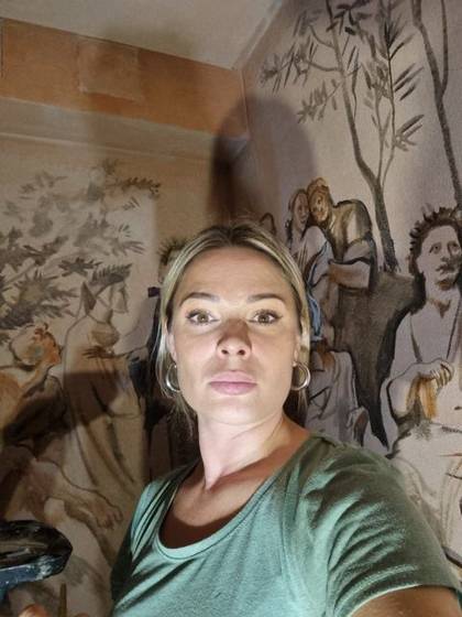 Liza Nabokova at work on a mural